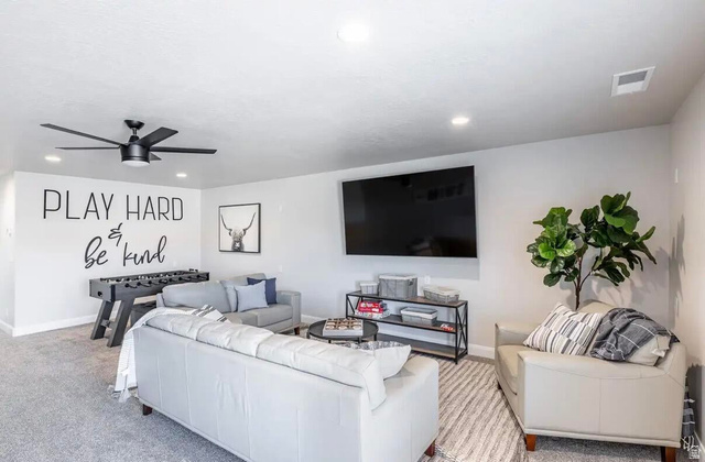 4846 Fishers Is Way St. George, UT 84770 - Photo 6 of 13 Spacious recreational area featuring recessed lighting, a modern ceiling fan, and carpeted flooring