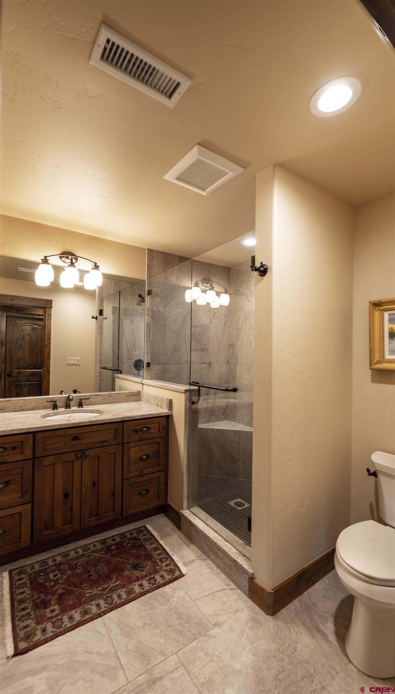 610 Red Rock Road Durango, CO 81301 - Photo 29 of 35 a bathroom with a sink and mirror