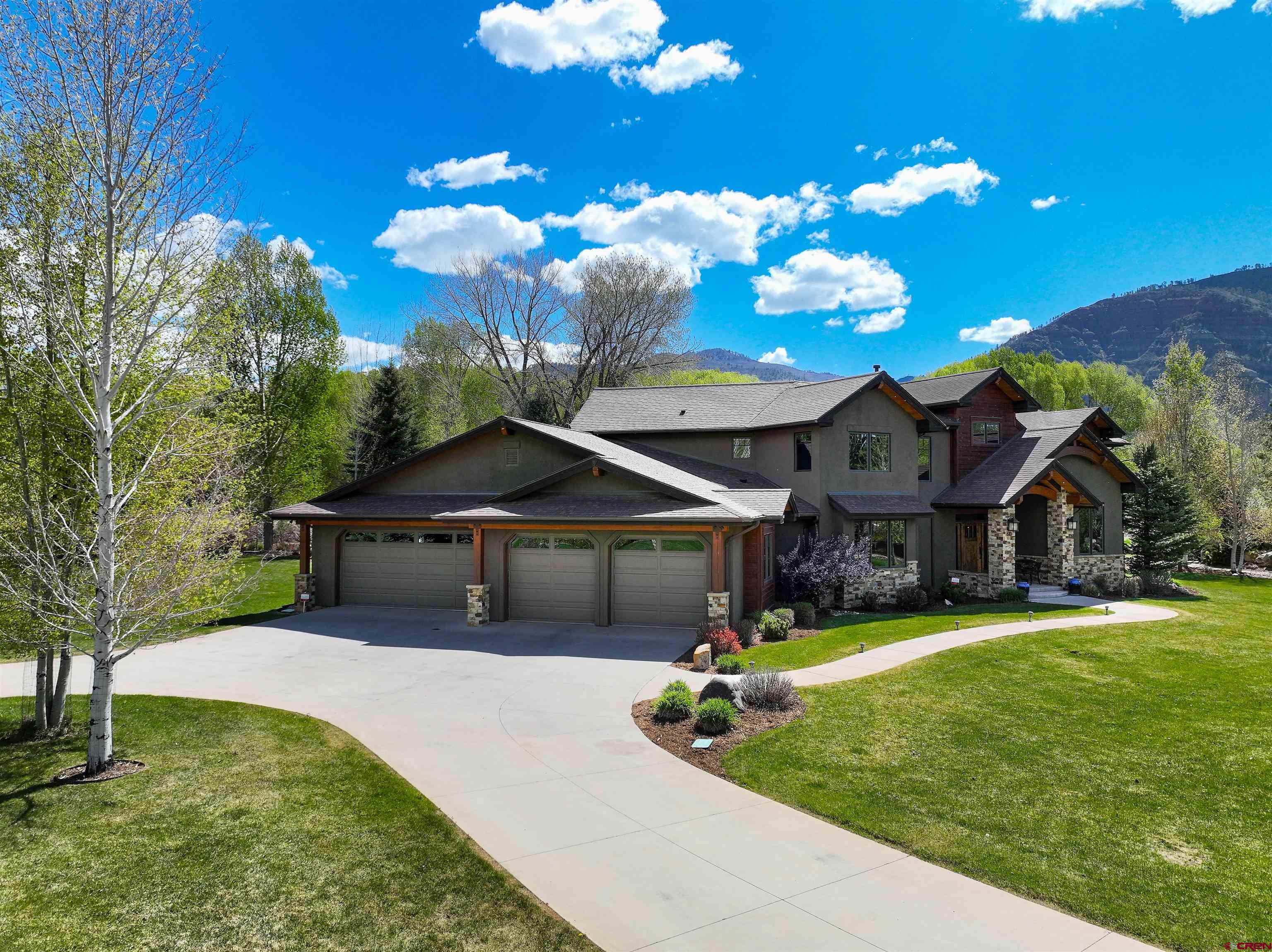 610 Red Rock Road Durango, CO 81301 - Photo 4 of 35 a front view of a house with garden