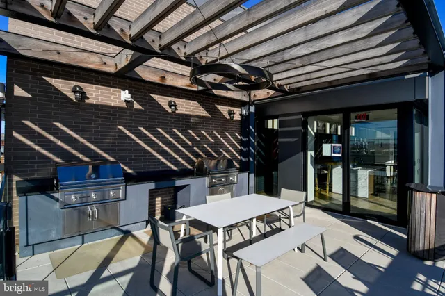a view of a chairs and table in a patio