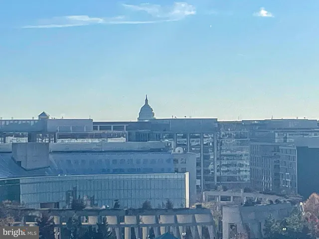a terrace with outdoor seating and city view