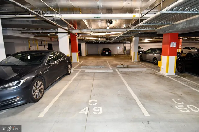 a lobby with furniture and view of living room
