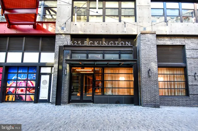 a front view of a building with glass windows