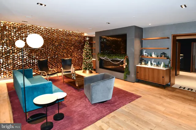 a kitchen with stainless steel appliances granite countertop a sink and a refrigerator