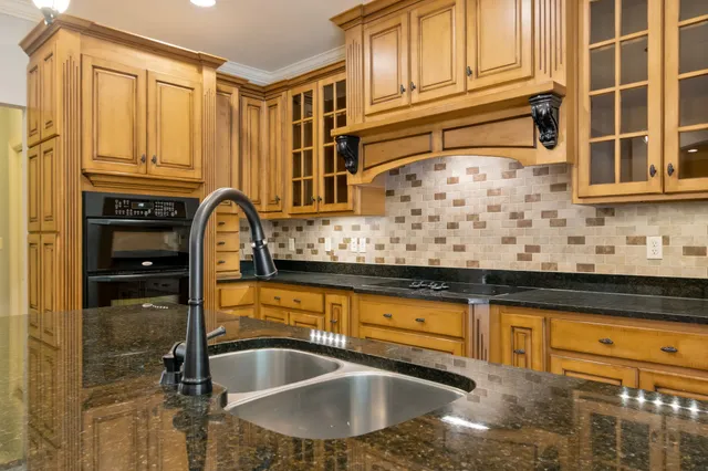 a spacious bathroom with a large tub sink and mirror