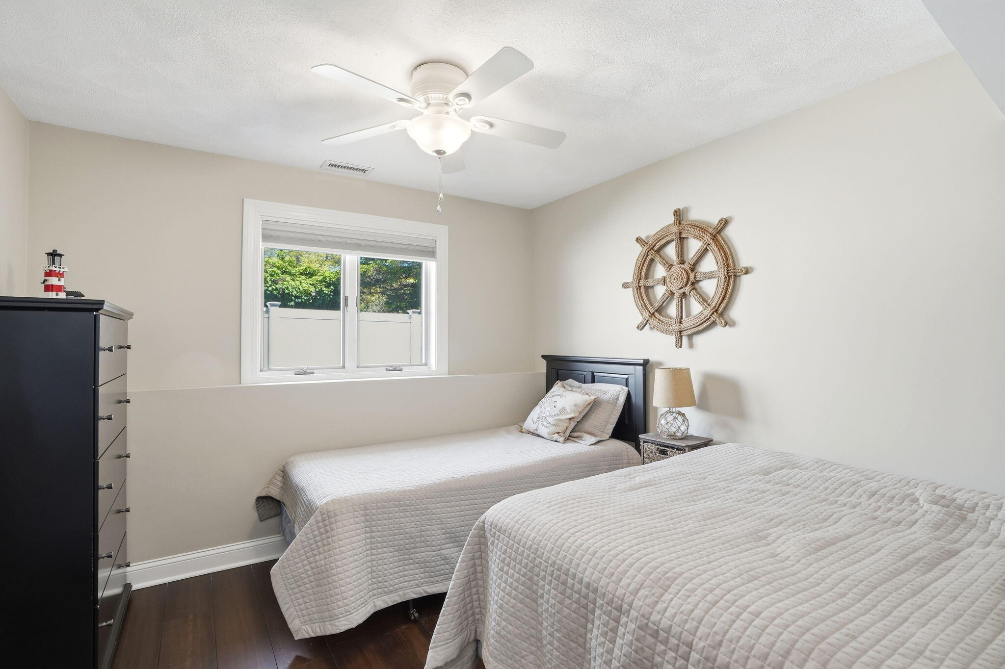 4 Cross Road Bourne, MA 02532 - Photo 32 of 47 a bedroom with a bed and a chandelier