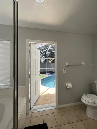 a bathroom with a sink toilet and mirror