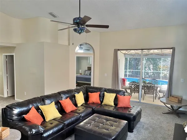a kitchen with stainless steel appliances a sink a stove a refrigerator and cabinets