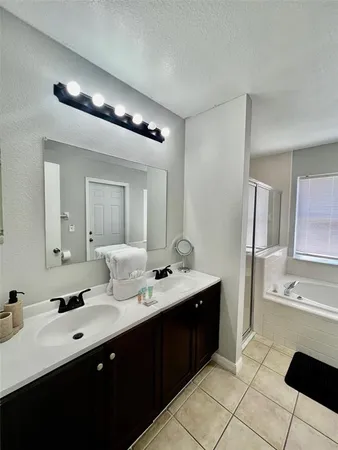 a bathroom with a bathtub and a sink