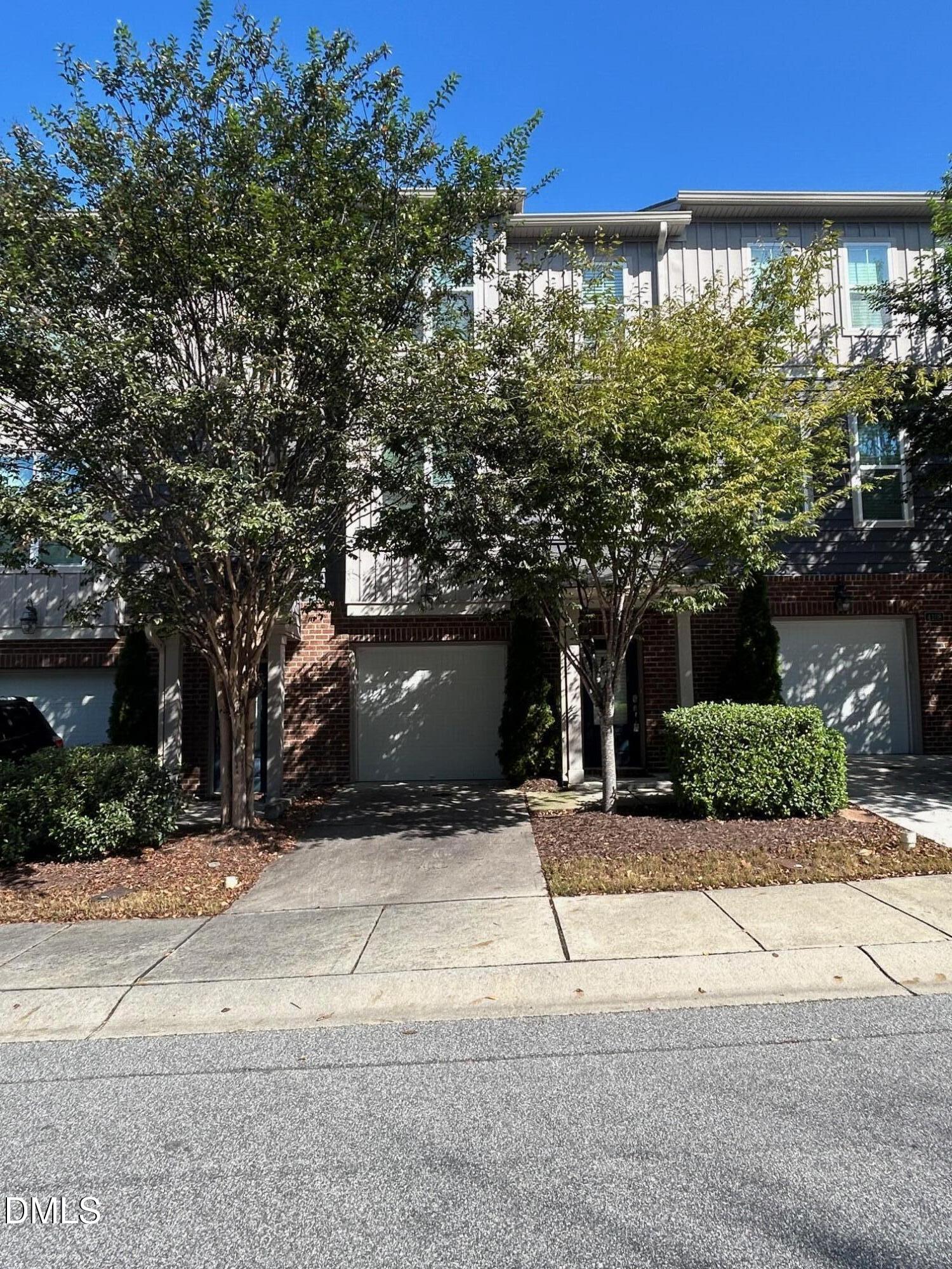 4110 Sykes Street Cary, NC 27519 - Photo 1 of 29 a front view of a house with a yard