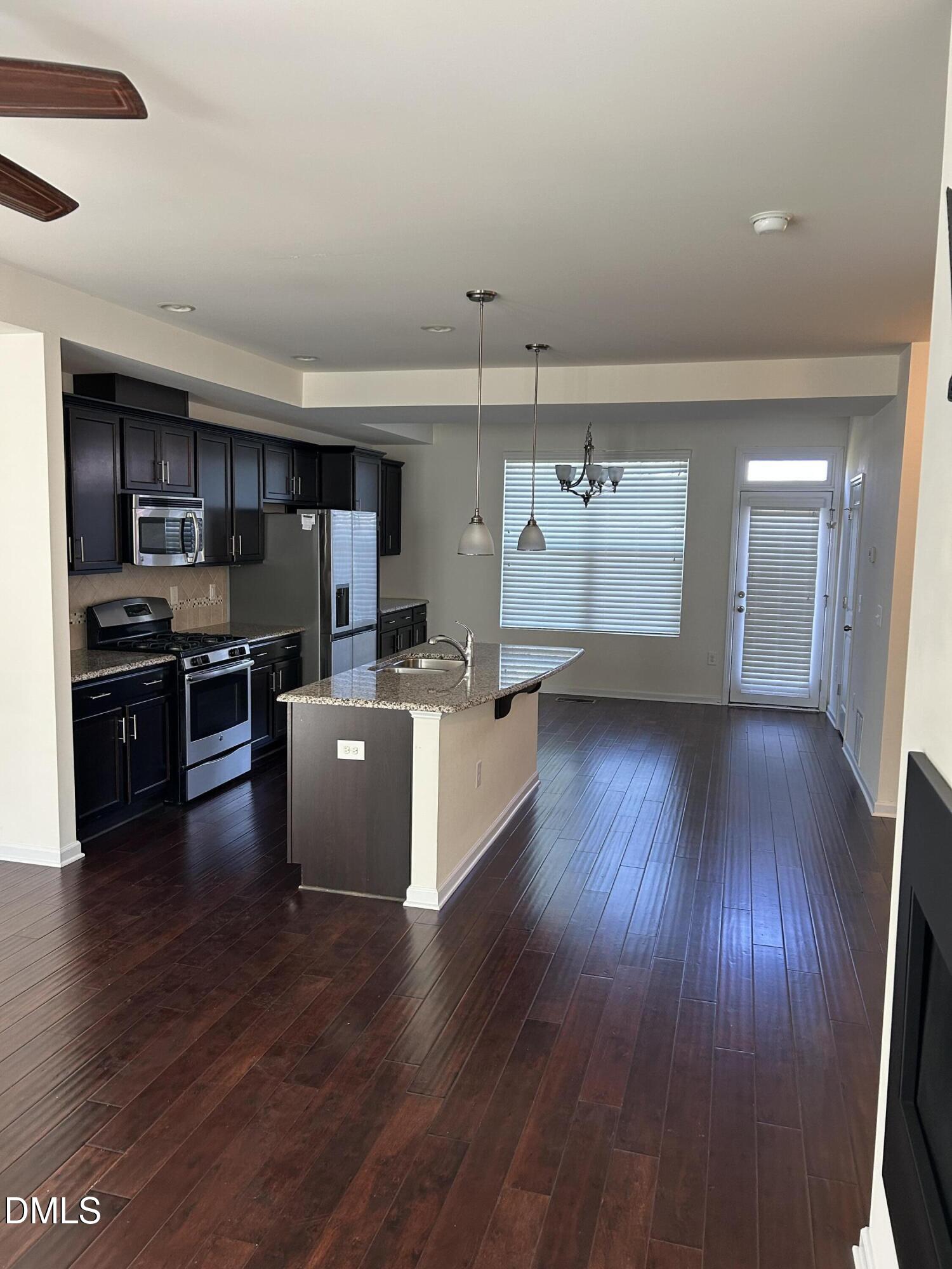 4110 Sykes Street Cary, NC 27519 - Photo 12 of 29 a view of kitchen with cabinets and wooden floor