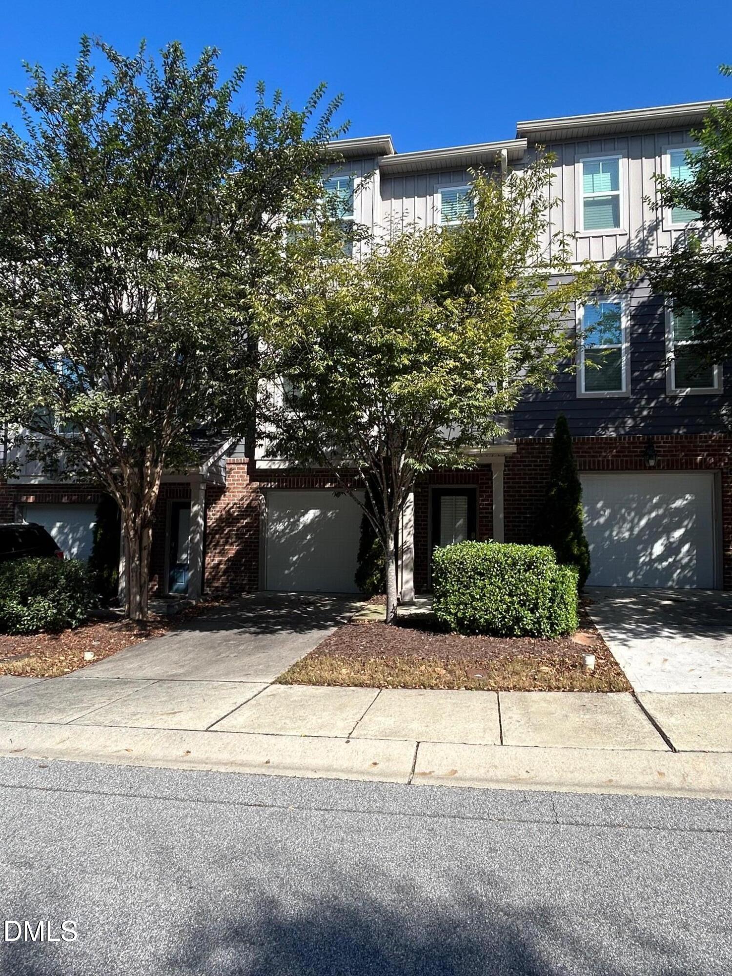 4110 Sykes Street Cary, NC 27519 - Photo 2 of 29 a house with trees in front of it