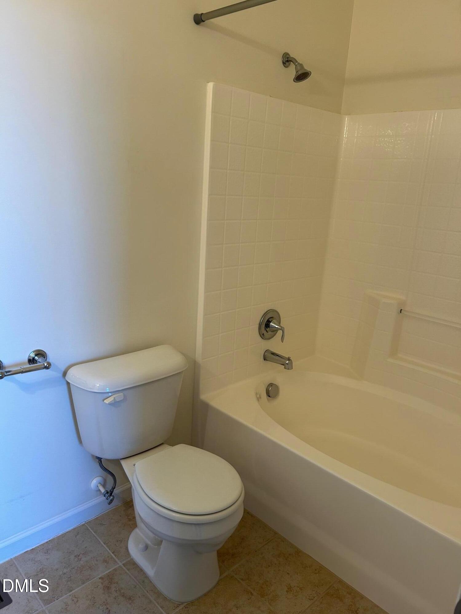 4110 Sykes Street Cary, NC 27519 - Photo 21 of 29 a white toilet sitting next to a bath tub and a shower