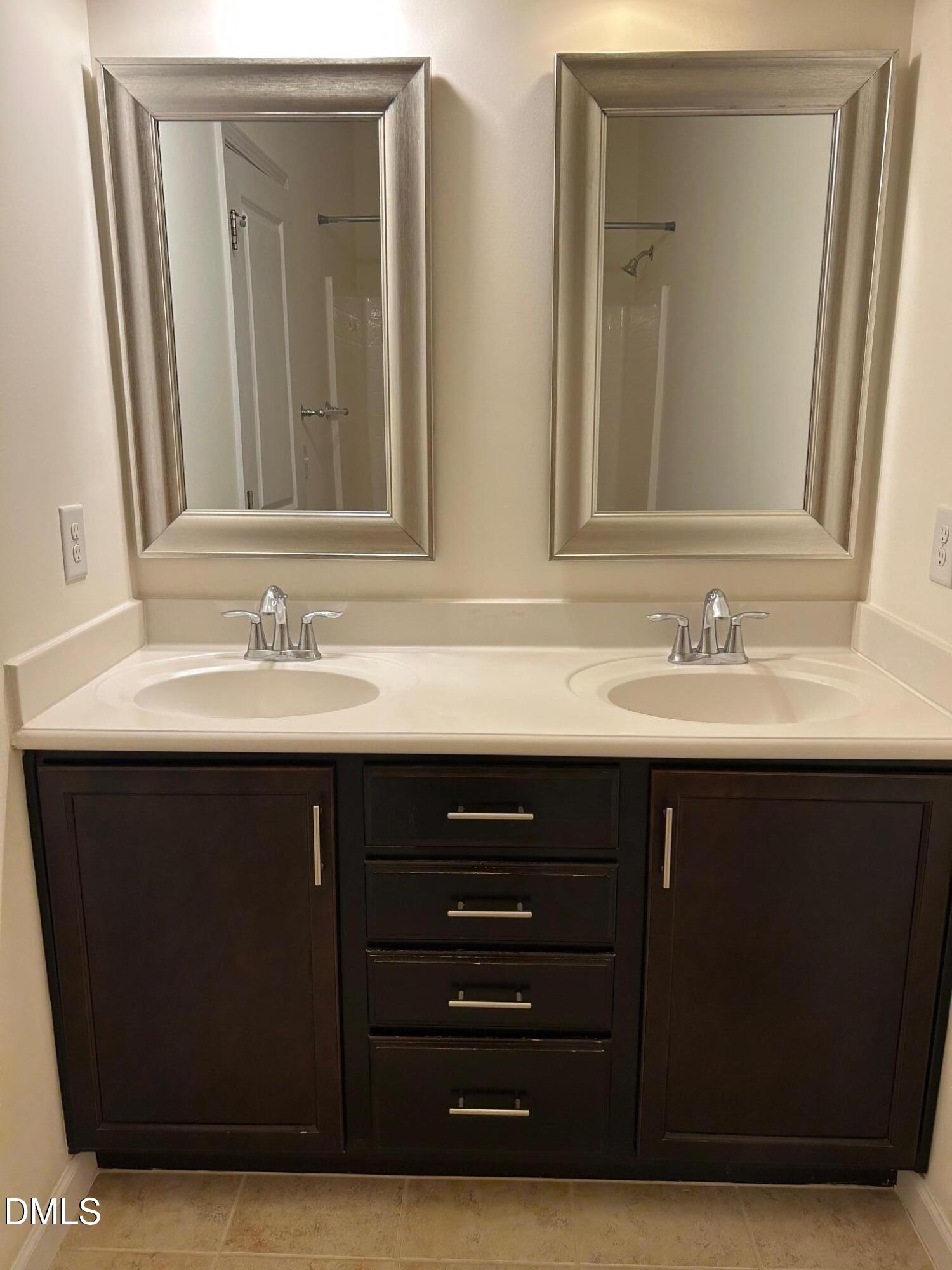 4110 Sykes Street Cary, NC 27519 - Photo 22 of 29 a bathroom with a sink vanity and mirror
