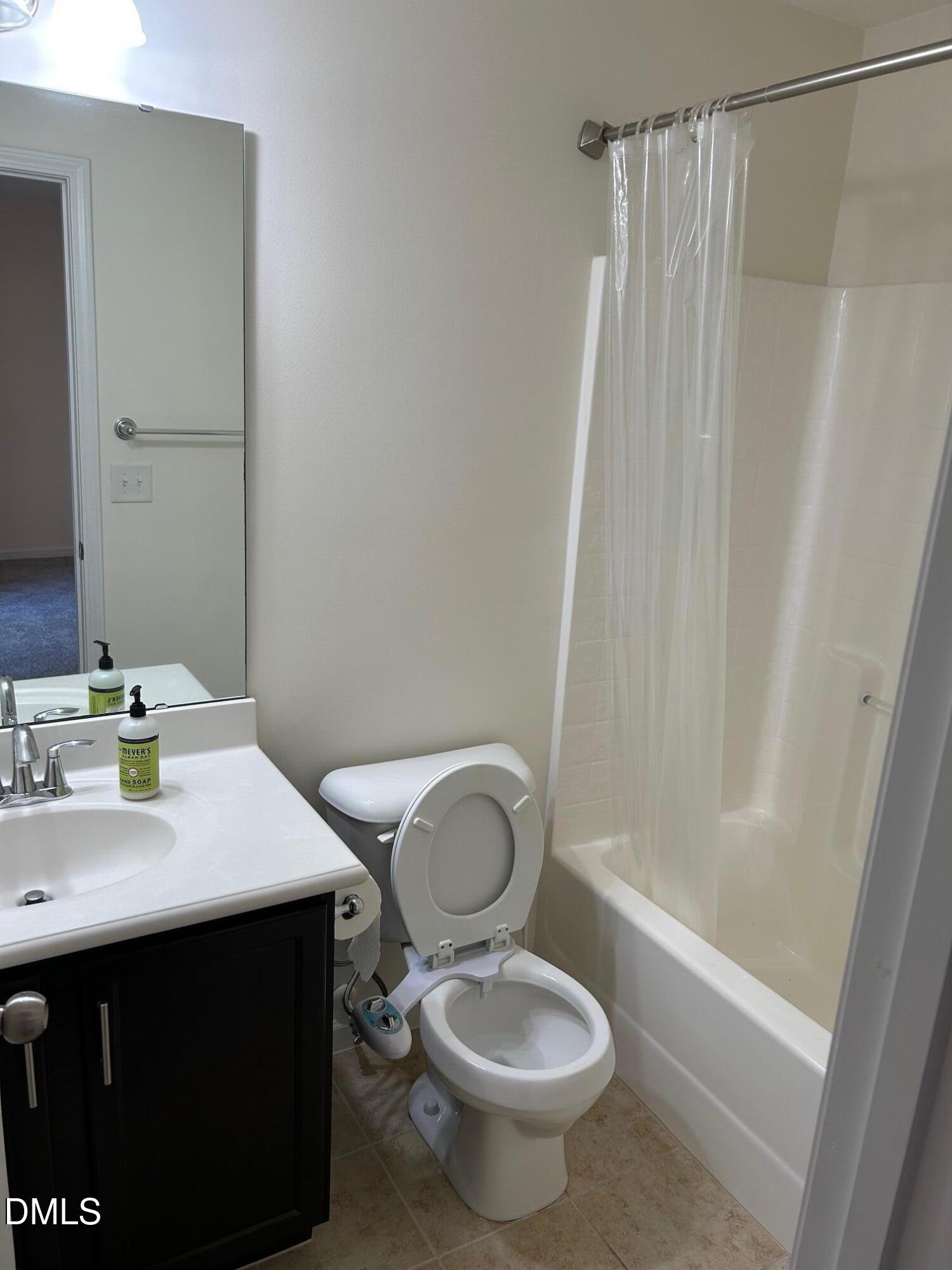 4110 Sykes Street Cary, NC 27519 - Photo 4 of 29 a bathroom with a sink toilet and shower