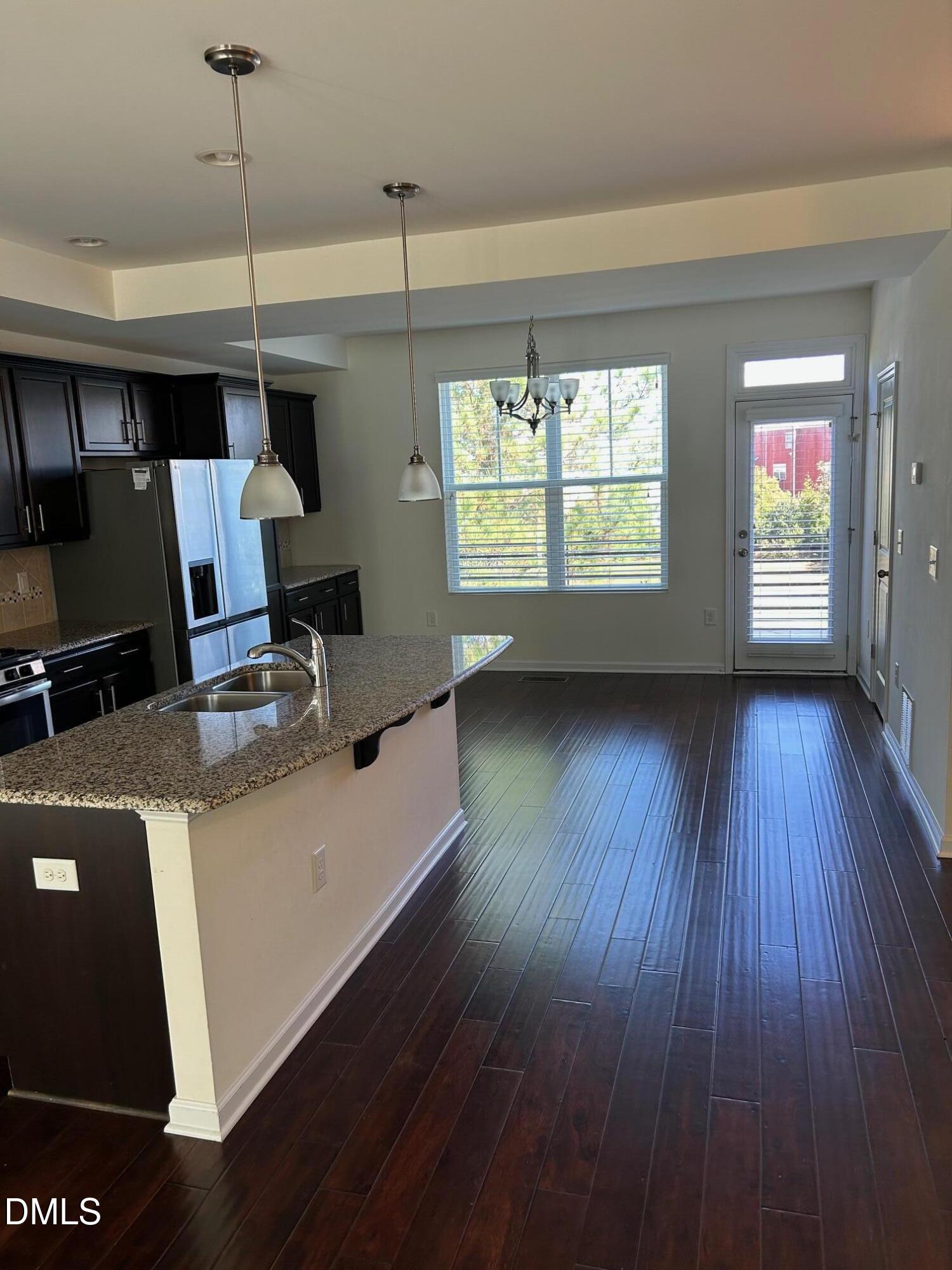 4110 Sykes Street Cary, NC 27519 - Photo 7 of 29 a view of a room with furniture wooden floor and window