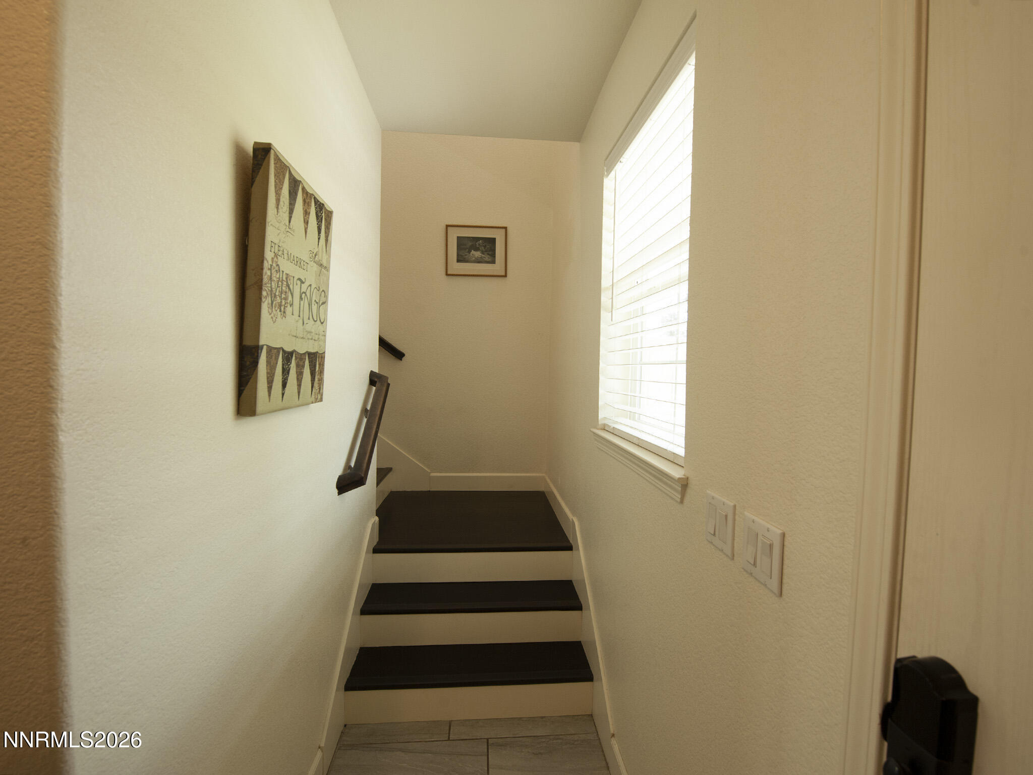 9766 Pachuca Drive Reno, NV 89521 - Photo 18 of 59 a view of entryway with wooden floor and stairs