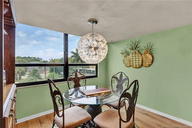 a view of a dining room with furniture window and outside view