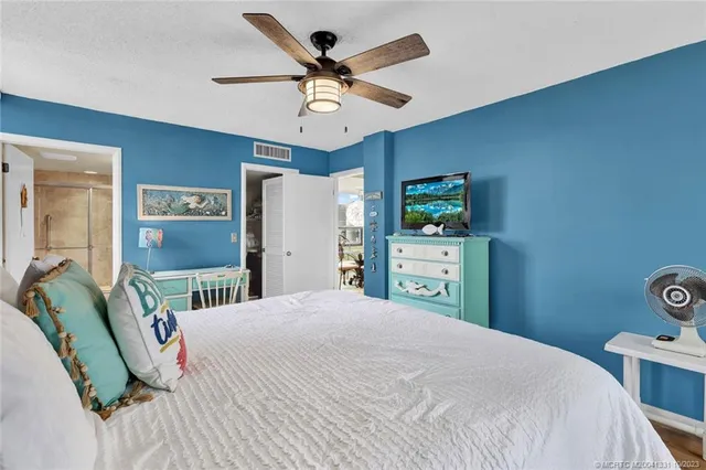 a bedroom with a bed dresser and a window