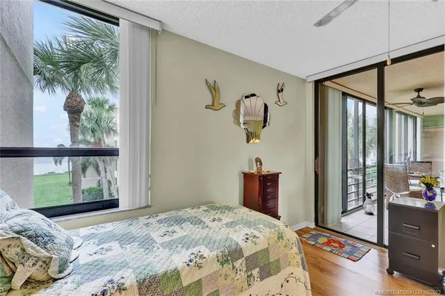 a bedroom with a bed dresser and a window