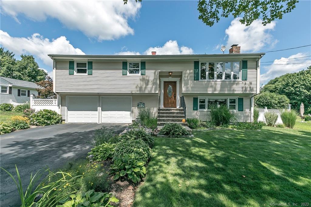 80 Post Oak Road Stratford, CT 06614 - Photo 1 of 1 a front view of a house with a yard
