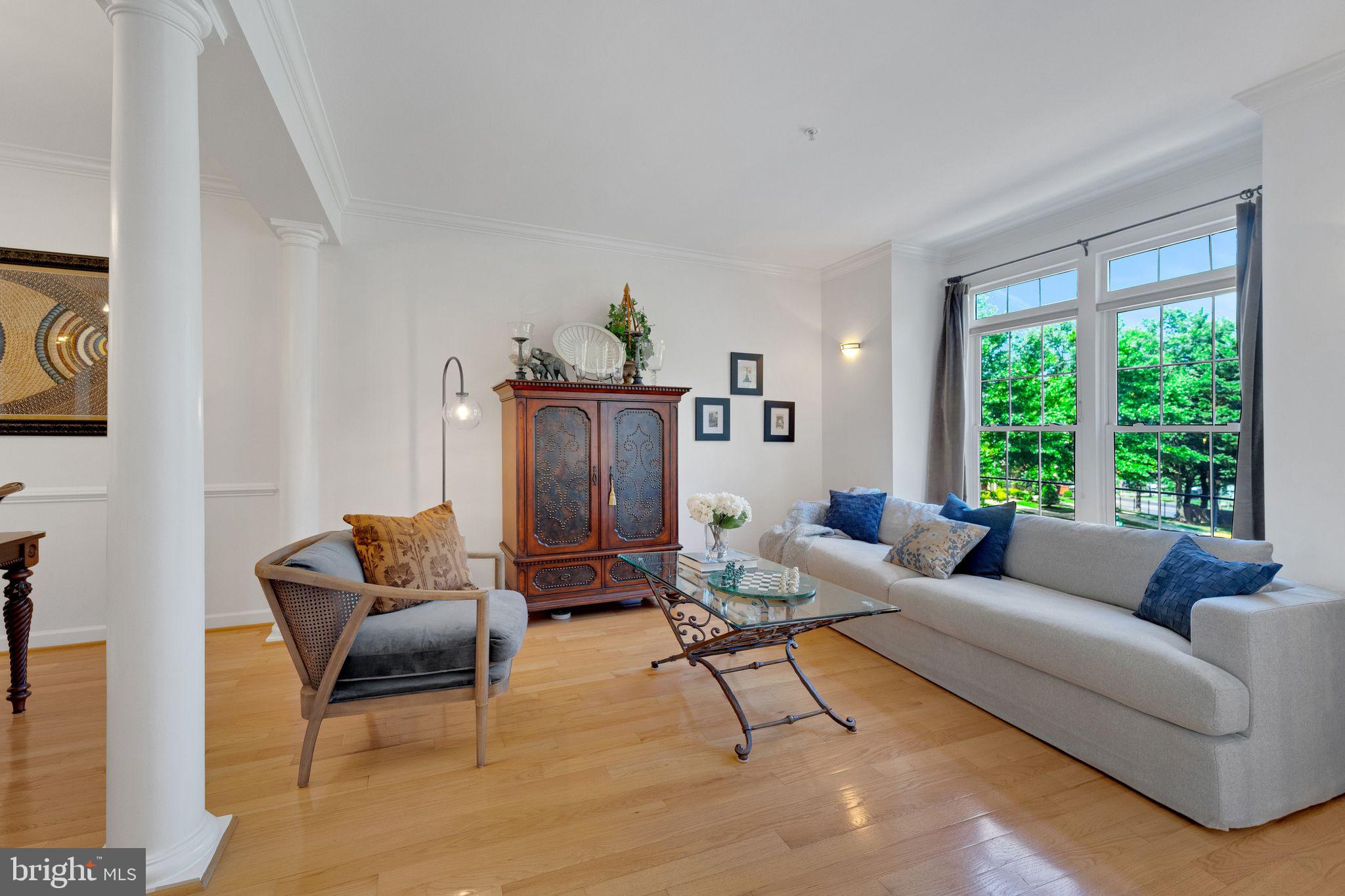 2116 Elm Tree Lane Silver Spring, MD 20906 - Photo 13 of 32 a living room with furniture and a large window