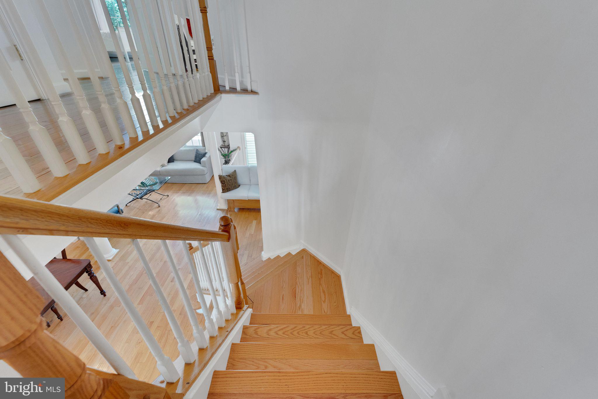 2116 Elm Tree Lane Silver Spring, MD 20906 - Photo 16 of 32 a view of staircase with railing and white walls