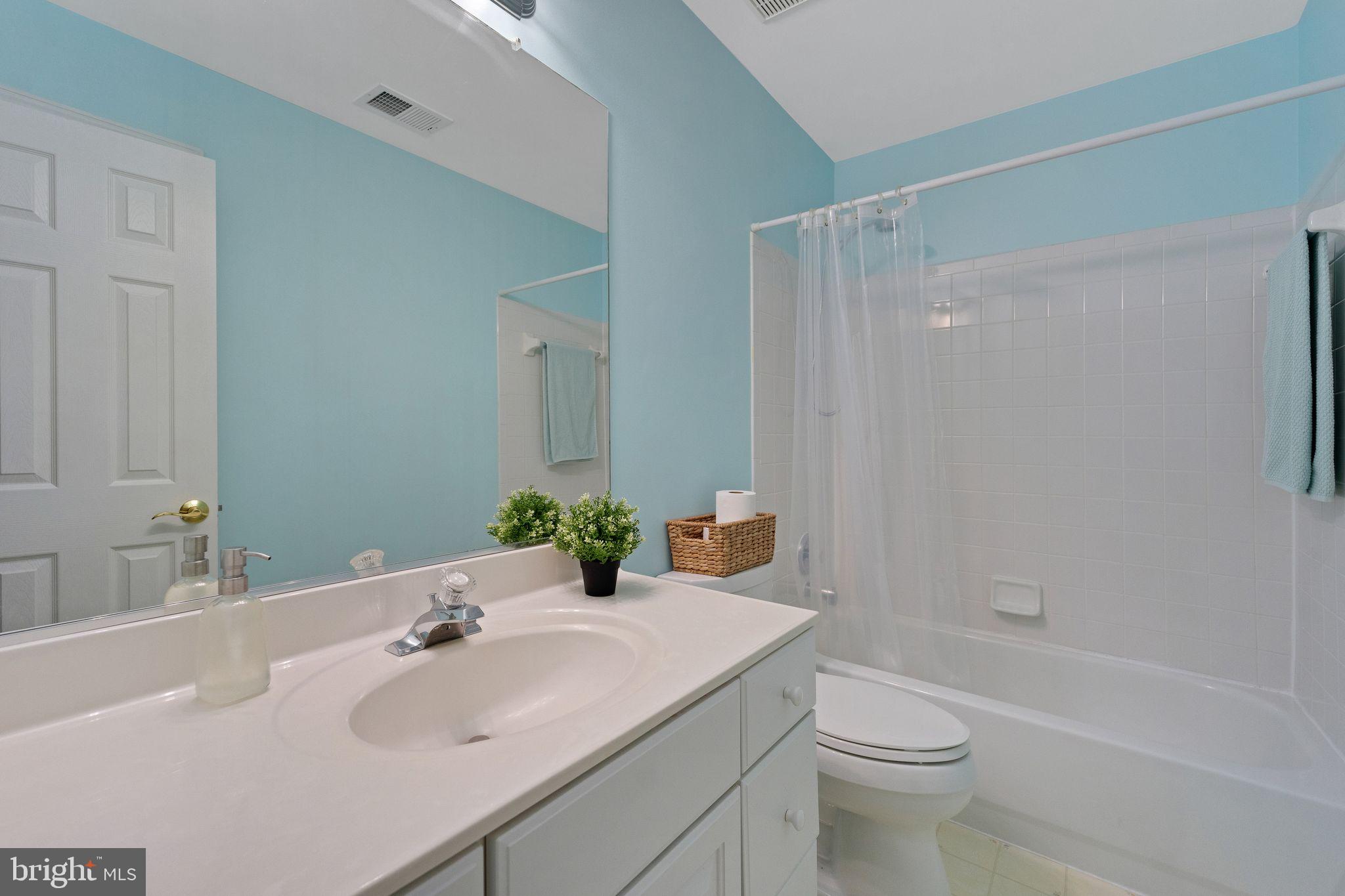 2116 Elm Tree Lane Silver Spring, MD 20906 - Photo 23 of 32 a bathroom with a sink toilet and shower
