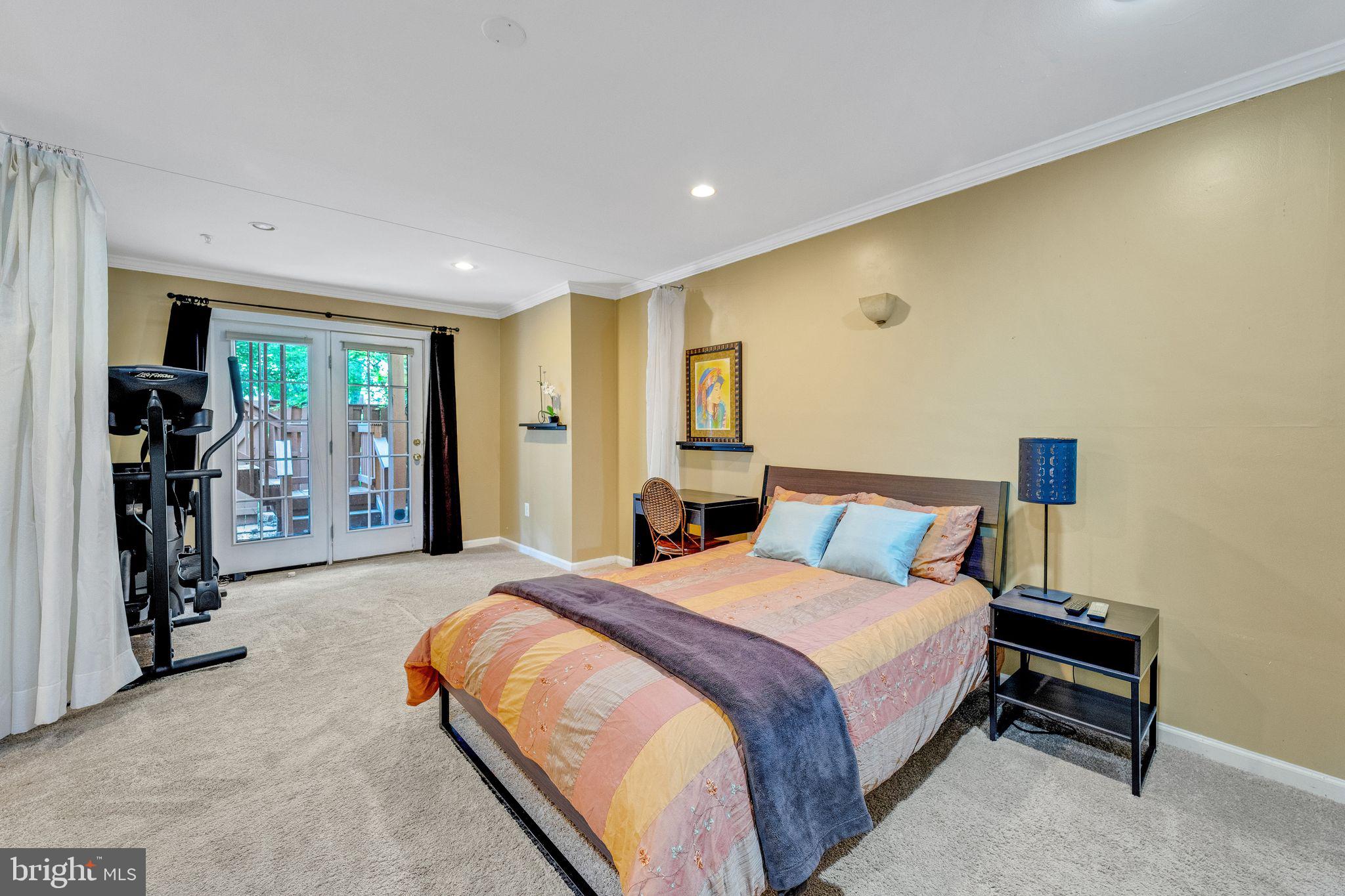 2116 Elm Tree Lane Silver Spring, MD 20906 - Photo 24 of 32 a spacious bedroom with a bed and a large window