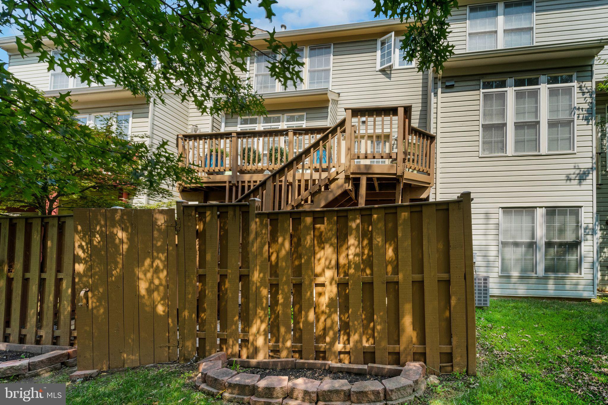 2116 Elm Tree Lane Silver Spring, MD 20906 - Photo 30 of 32 a front view of house with an outdoor space and seating area