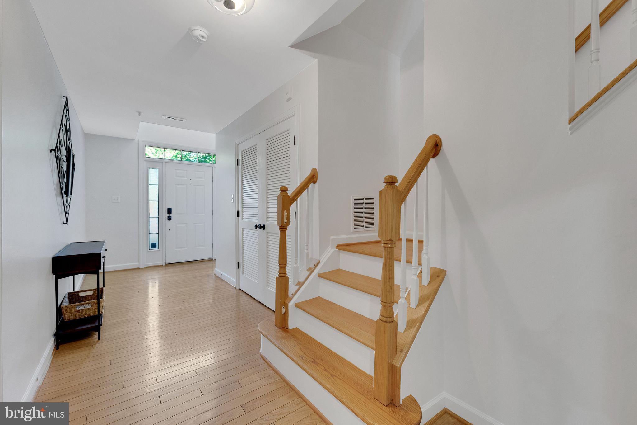 2116 Elm Tree Lane Silver Spring, MD 20906 - Photo 3 of 32 a view of a livingroom with wooden floor and stairs