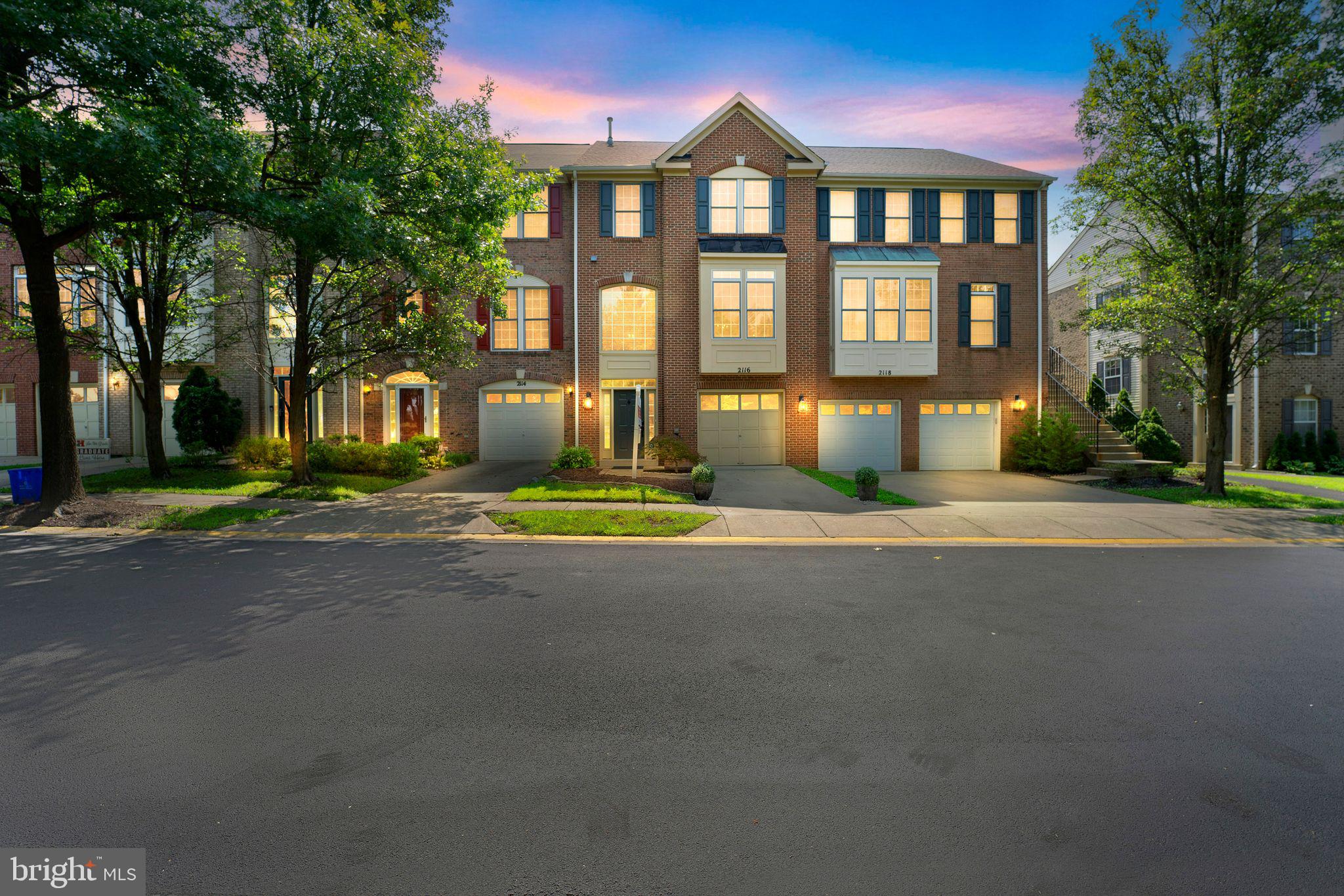 2116 Elm Tree Lane Silver Spring, MD 20906 - Photo 32 of 32 a front view of a house with a yard