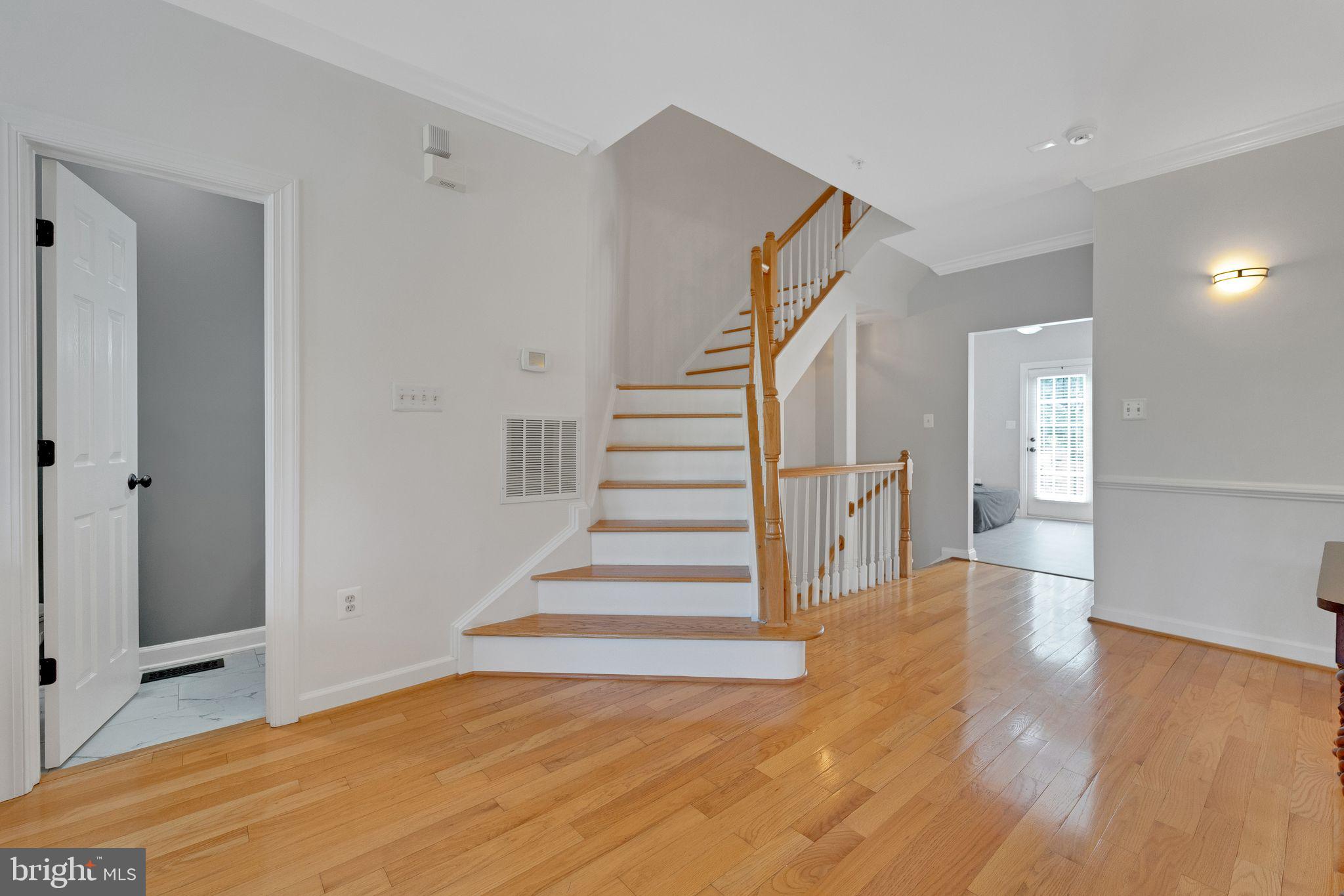 2116 Elm Tree Lane Silver Spring, MD 20906 - Photo 4 of 32 a view of entryway with wooden floor and stairs