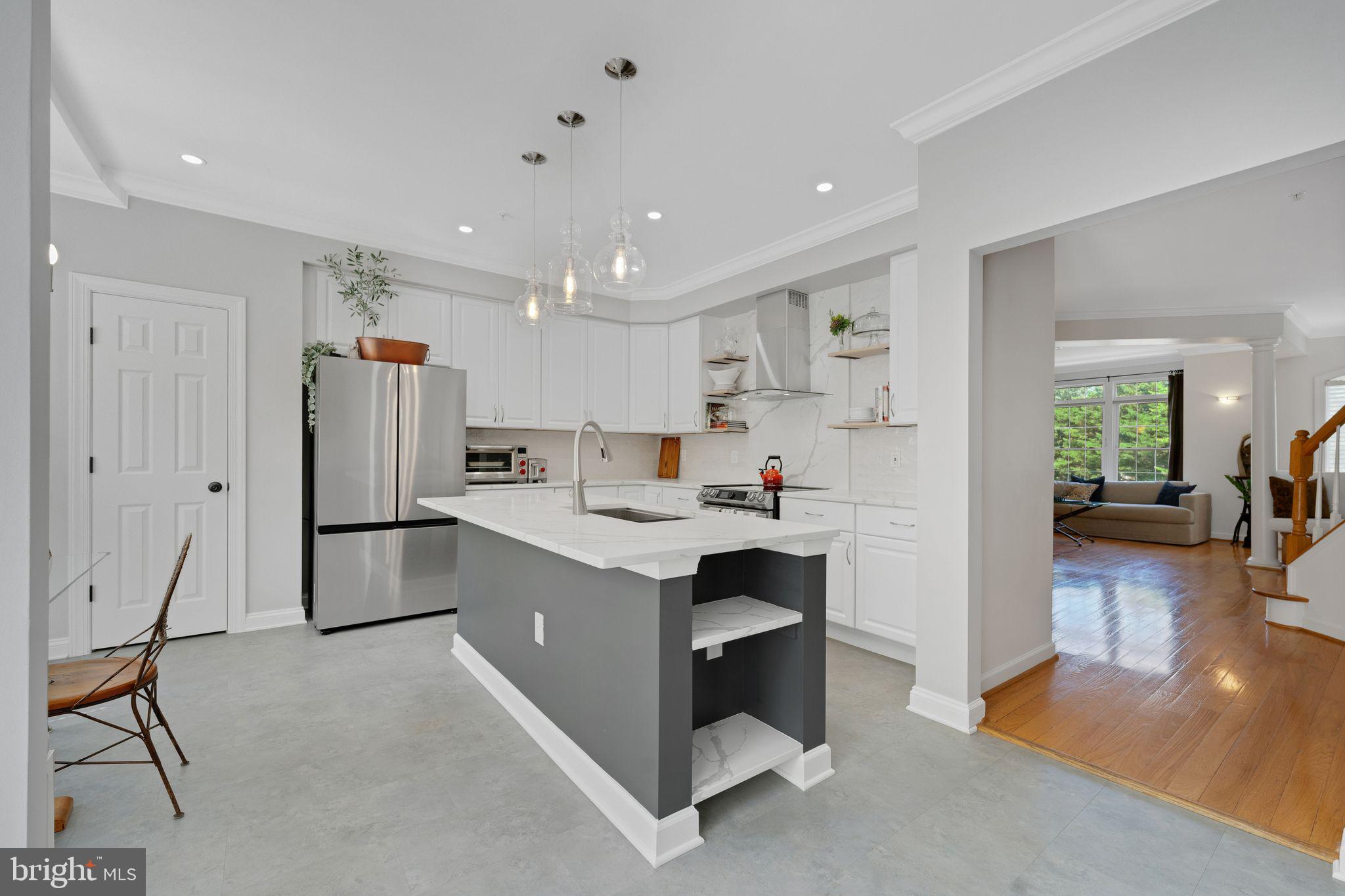 2116 Elm Tree Lane Silver Spring, MD 20906 - Photo 7 of 32 a kitchen with refrigerator and cabinets