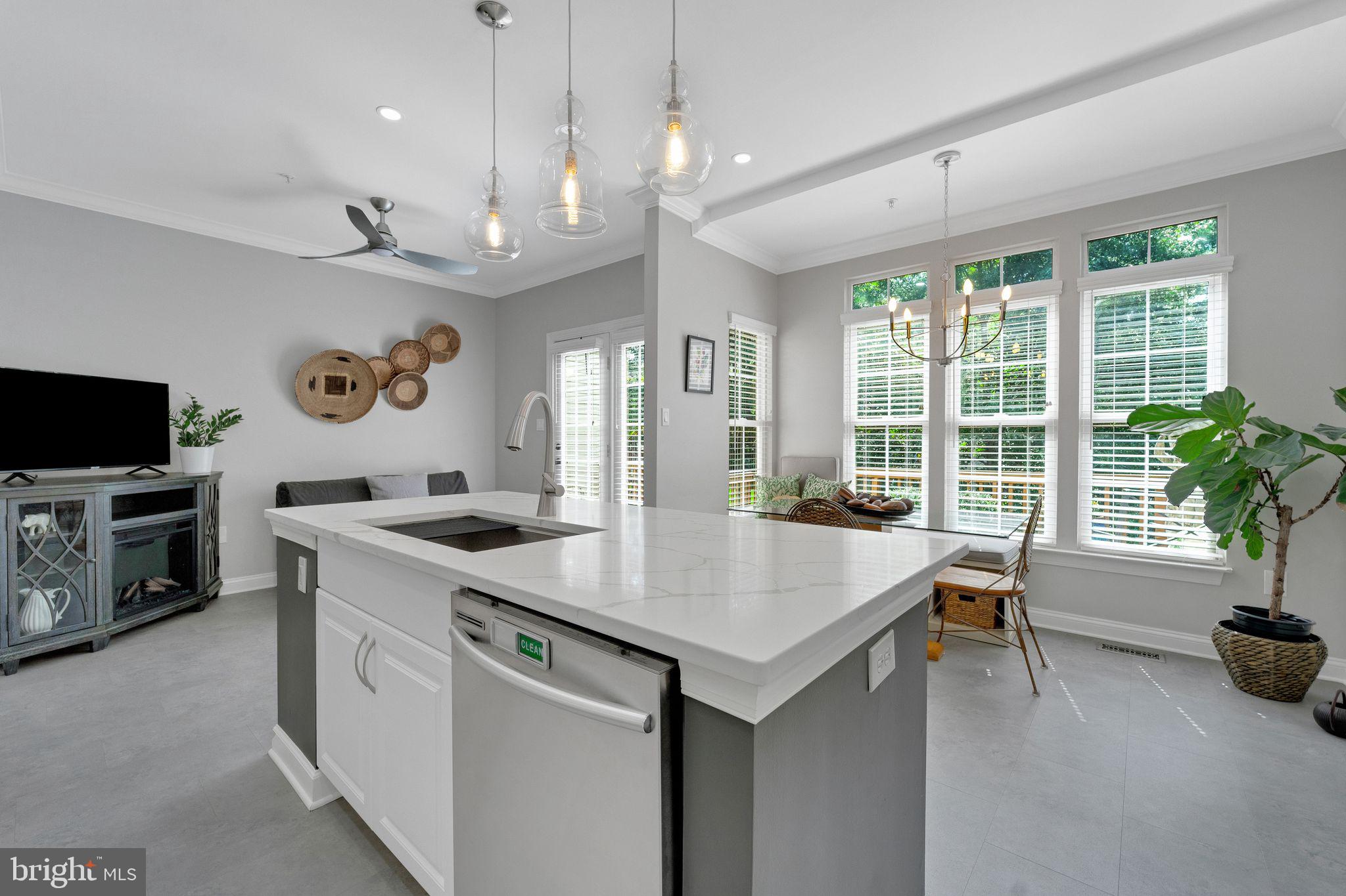 2116 Elm Tree Lane Silver Spring, MD 20906 - Photo 10 of 32 a open kitchen with stainless steel appliances granite countertop a stove and kitchen island with chair