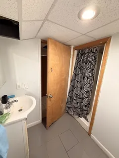 a bathroom with a tub and shower