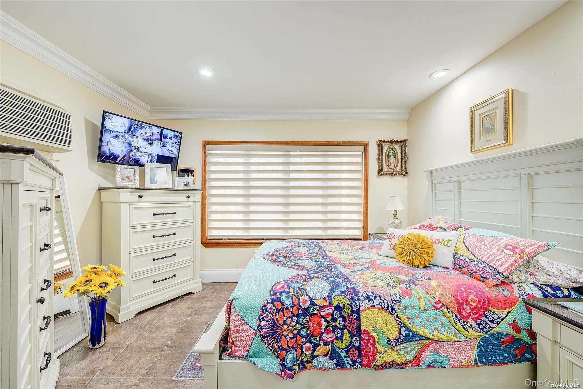 43-33 163rd Street Queens, NY 11358 - Photo 17 of 31 a bedroom with a bed and a window