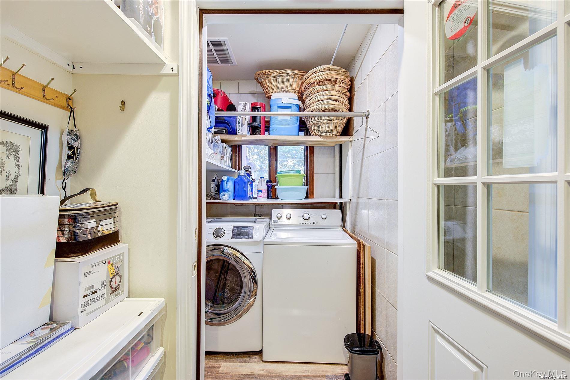 43-33 163rd Street Queens, NY 11358 - Photo 29 of 31 a utility room with dryer and washer