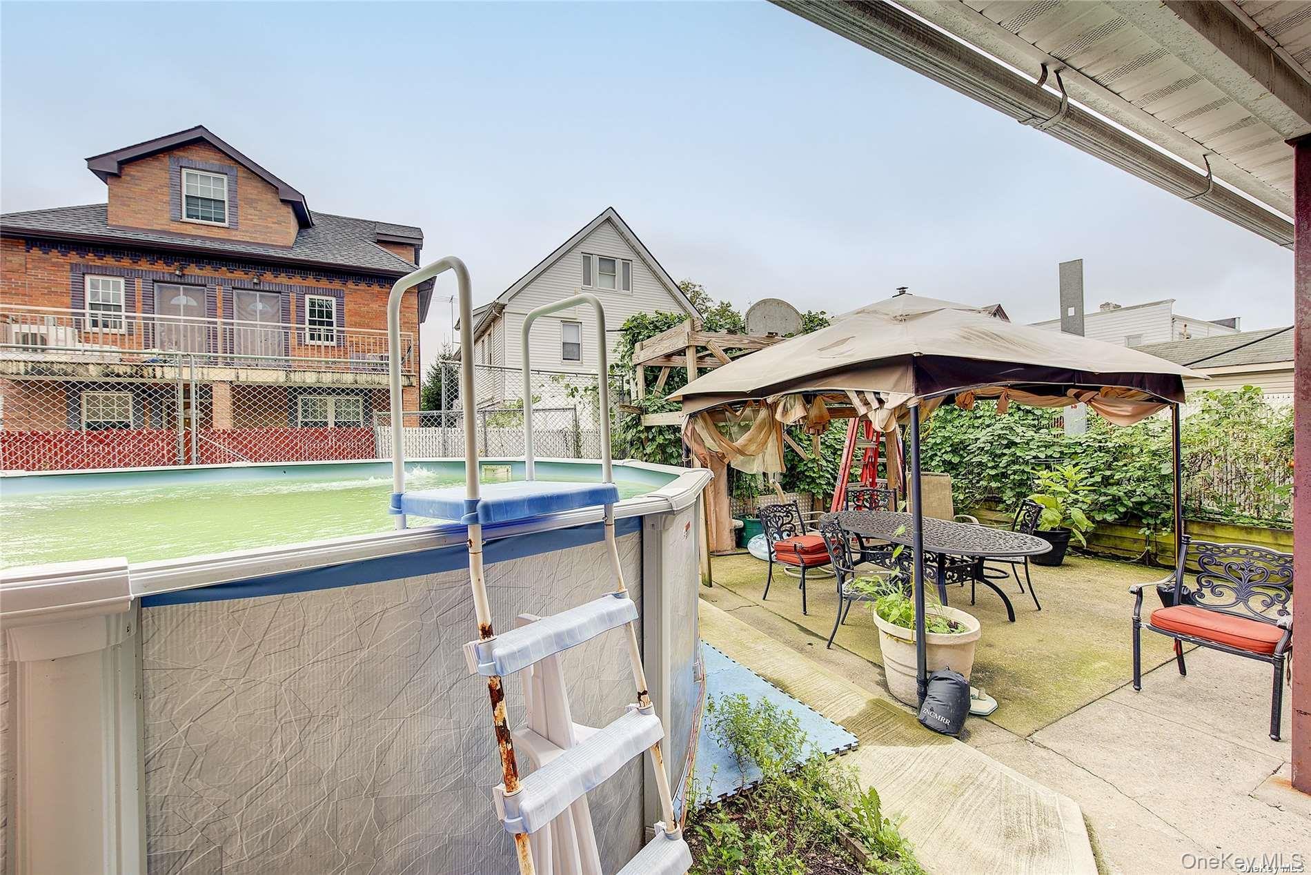 43-33 163rd Street Queens, NY 11358 - Photo 31 of 31 a view of an chairs and table in the balcony
