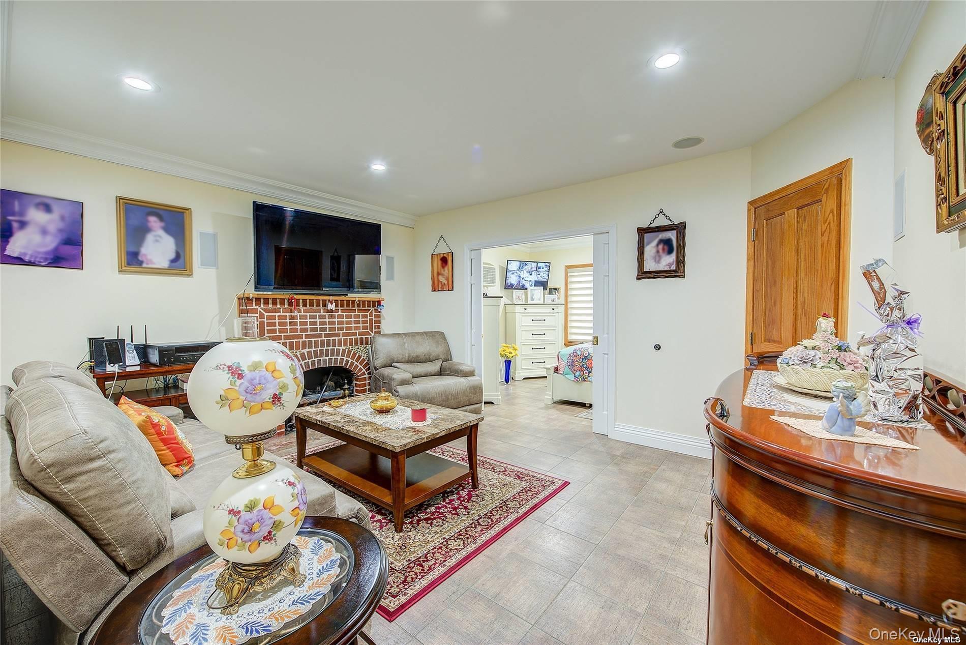 43-33 163rd Street Queens, NY 11358 - Photo 4 of 31 a living room with furniture and a flat screen tv