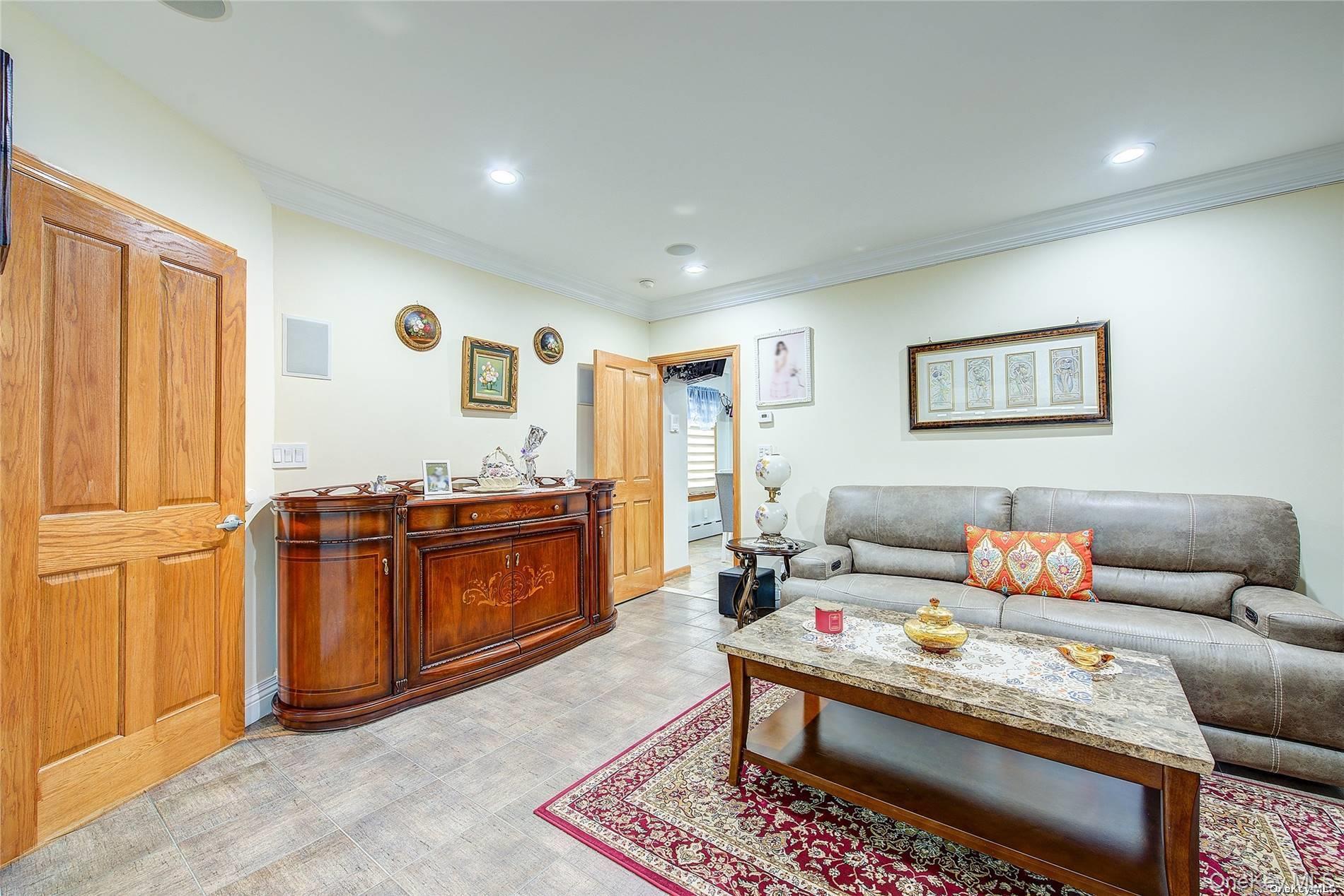 43-33 163rd Street Queens, NY 11358 - Photo 5 of 31 a living room with furniture and wooden floor