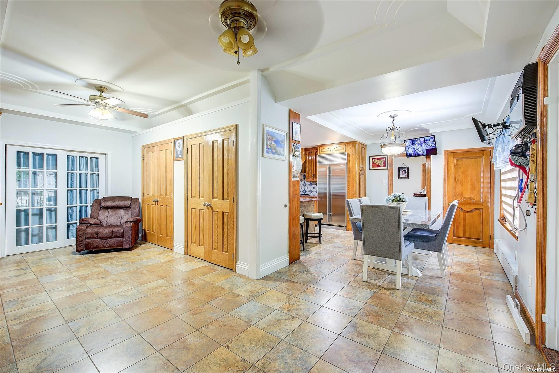 43-33 163rd Street Queens, NY 11358 - Photo 9 of 31 a living room with furniture and a window
