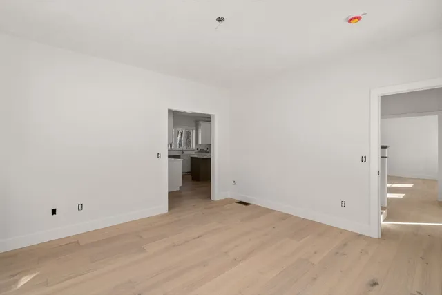 a view of a gate with wooden fence