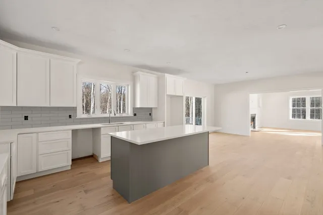a view of a kitchen with a sink cabinets and a window