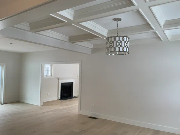 a view of a livingroom with a ceiling fan window and a ceiling fan