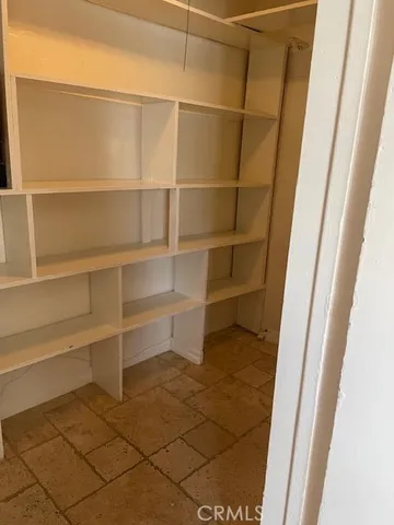 a kitchen with stainless steel appliances granite countertop a refrigerator stove and microwave