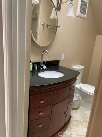 view of a hallway with wooden floor and closet