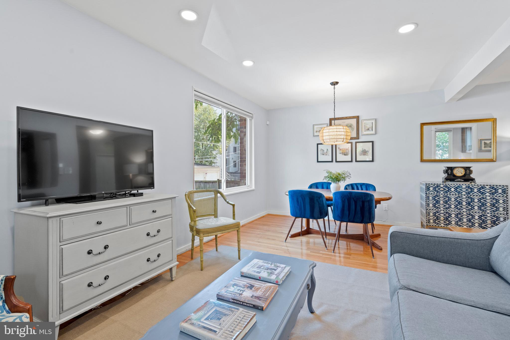 2639 15th Street Northwest, Unit 104 Washington, DC 20009 - Photo 12 of 36 a living room with furniture and a flat screen tv