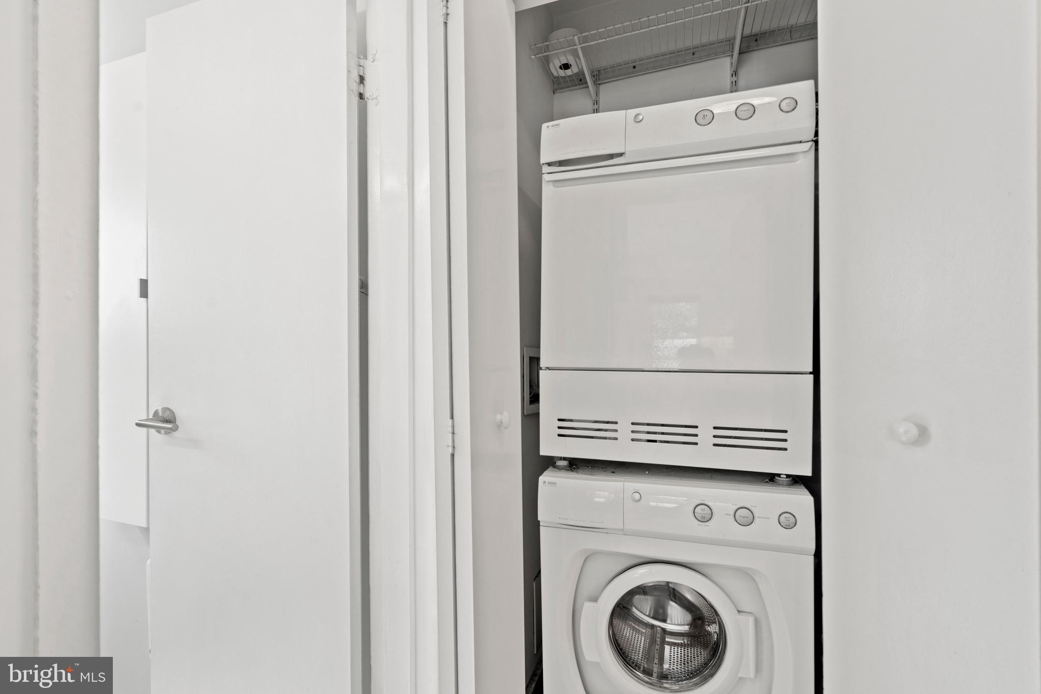 2639 15th Street Northwest, Unit 104 Washington, DC 20009 - Photo 18 of 36 a utility room with dryer and washer
