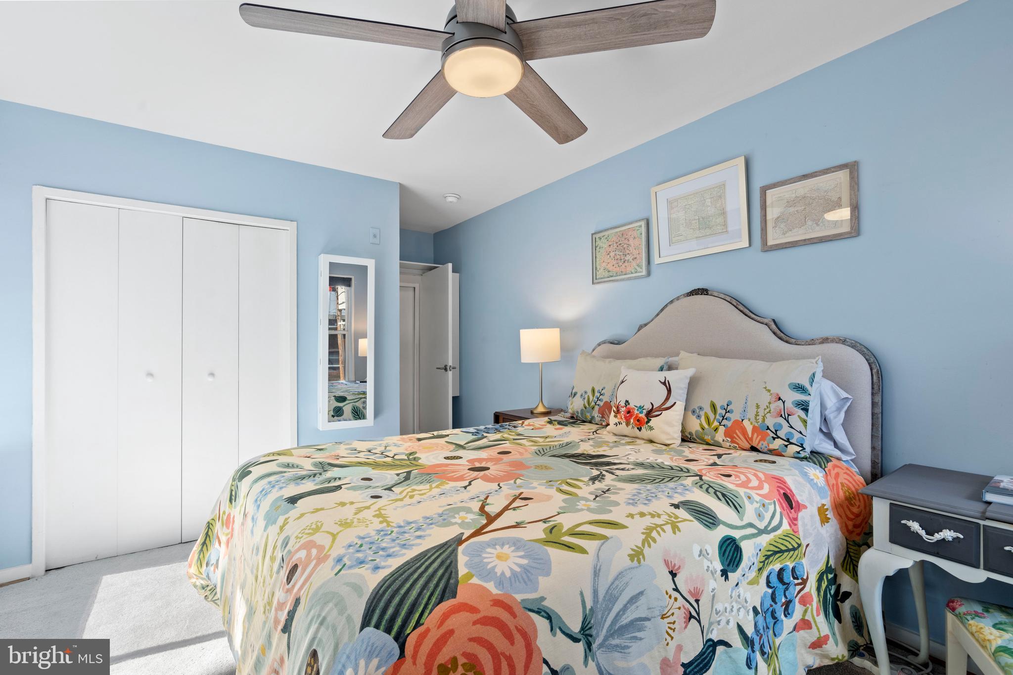 2639 15th Street Northwest, Unit 104 Washington, DC 20009 - Photo 20 of 36 a bedroom with a bed and a chandelier